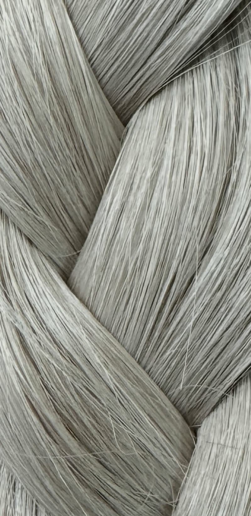 Ice blonde weft hair, plaited.