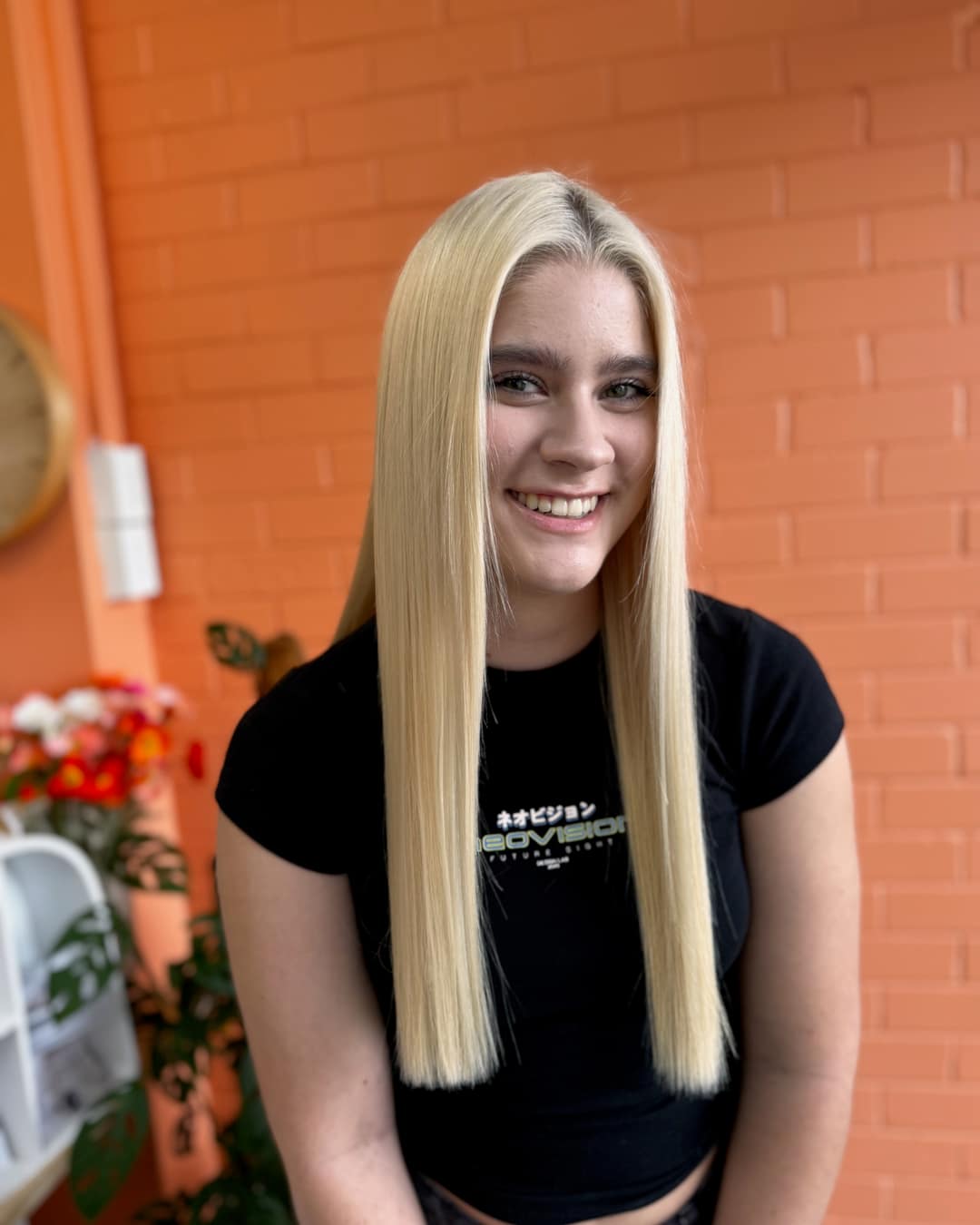 Long blonde extensions after an install.